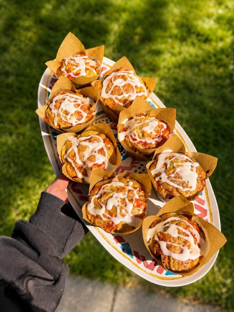 A platter piled with glazed streusel muffins.